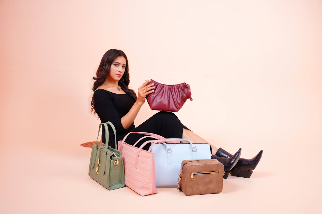 services-03 Stylish model showcasing a collection of designer handbags in Lahore.